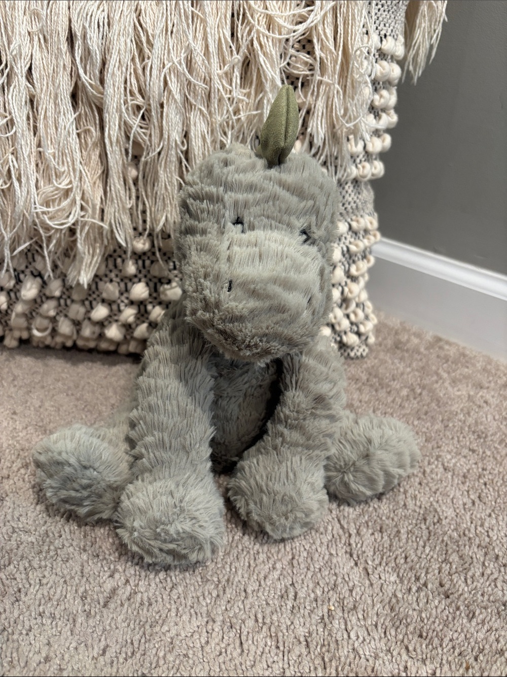 This is a Jellycat Fuddlewuddle Dino plush toy.